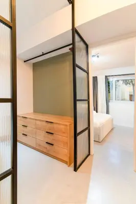 a bedroom with a bunk bed and a large mirror at Katia's Central 3Bdr 3Bthr Aprt in Athens