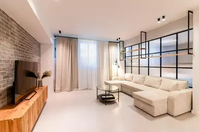 a living room with a couch and a tv at Katia's Central 3Bdr 3Bthr Aprt in Athens