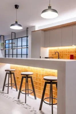 a kitchen with two stools and a counter with yellow tiles at Katia's Central 3Bdr 3Bthr Aprt in Athens