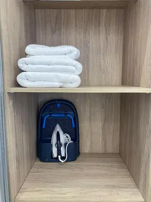 a drawer with towels and a blue cooler in it at Modern Athens Apartment with Large Private Balcony in Athens