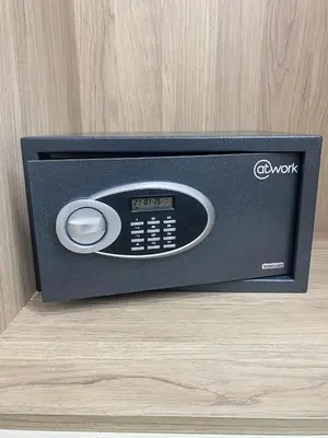 a black tv with a remote control in a drawer at Modern Athens Apartment with Large Private Balcony in Athens
