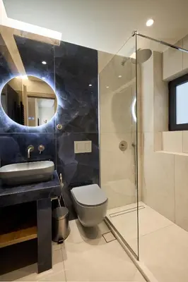 a bathroom with a toilet and a sink and a mirror at Kolonaki Silent Elegance in Athens