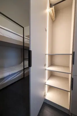 a room with white walls and bunk beds at Kolonaki Silent Elegance in Athens