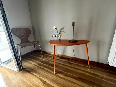 a table with a lamp and a chair in a room at Lovely, brand new, central , Modern appt Athenes - Axelle Place in Athens