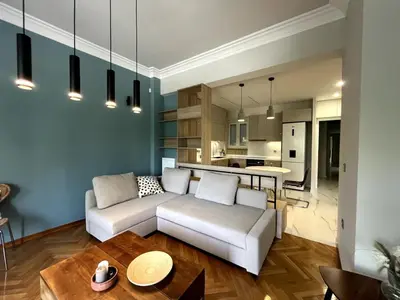 a living room with a couch and a table at Lovely, brand new, central , Modern appt Athenes - Axelle Place in Athens