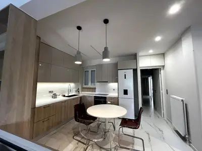 a kitchen with a table and chairs in a kitchen at Lovely, brand new, central , Modern appt Athenes - Axelle Place in Athens