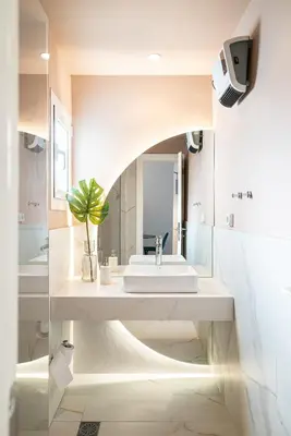 a white bathroom with a sink and a mirror at Filoxenia MG Projects Eggeli Athens in Athens