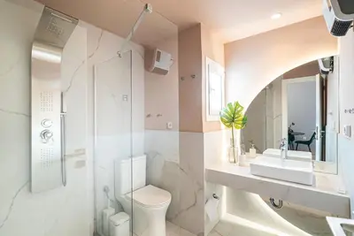 a bathroom with a toilet and a sink and a shower at Filoxenia MG Projects Eggeli Athens in Athens