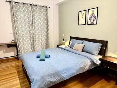 a bedroom with a bed with a teddy bear on it at 3BD next to National Archaeological Museum in Athens
