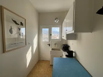 a small bathroom with a sink and a sink at Quiet, Sunny & Terrace with Acropolis View in Athens