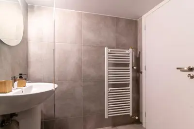 a bathroom with a sink and a shower at Modern 2-Bedroom Apt in Athens in Athens