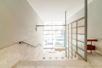 a staircase in a house with a glass wall at Modern 2-Bedroom Apt in Athens in Athens