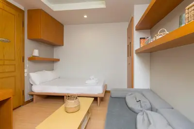 a small room with a bed and a couch at Secret Base In Central Athens in Athens