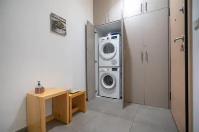 a laundry room with a washer and a washing machine at Central Athens Apt Street View by MPS in Athens