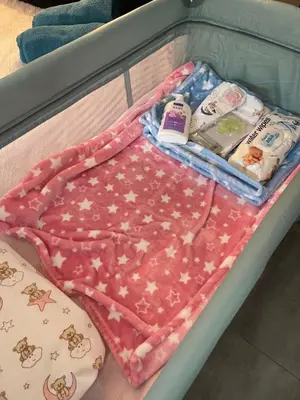 a bed with blankets and other items on it at Chambres Élysées in Athens