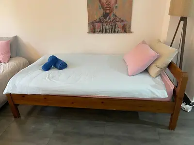 a bed with two pillows on top of it at Chambres Élysées in Athens