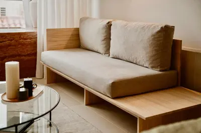 a couch in a living room with a table at Ermou 18 Private Jacuzzi Apartment in Athens
