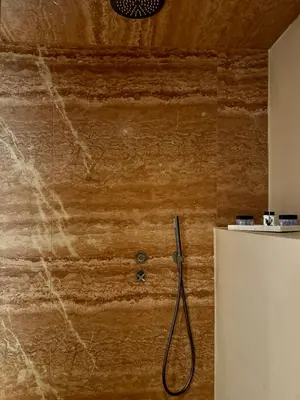 a bathroom with a hose hooked up to a wall at Ermou 18 Private Jacuzzi Apartment in Athens