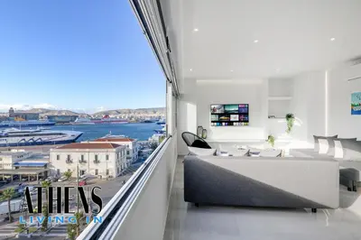 a living room with a view of the water at Endless Blue Breathtaking View Apt 6fl 2&4ppl in Piraeus