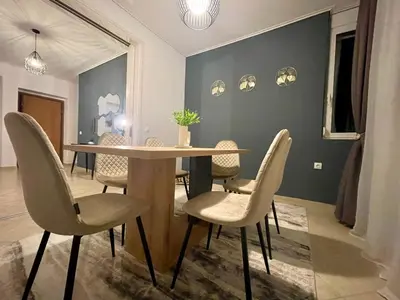 a dining room with a table and chairs at Thalassea - Athenian Riviera in Athens