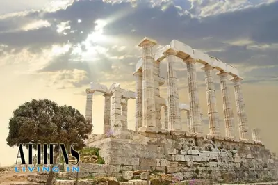 an ancient building with columns in front of the sun at Endless Blue Breathtaking View Apt 7fl 2&4ppl in Piraeus