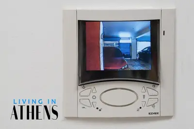 a box with a picture of a living in athens at Athenian Exclusive residence 4&2 ppl in Athens