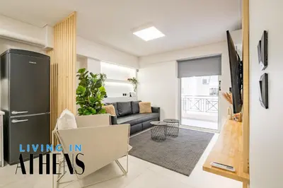 a living room with a couch and a refrigerator at Athenian Exclusive residence 4&2 ppl in Athens