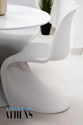a white toilet seat next to a white table at Athenian Exclusive residence 4&2 ppl in Athens