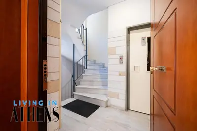 a hallway with a door and stairs in a house at Athenian Exclusive residence 4&2 ppl in Athens
