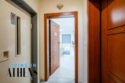 a hallway with a door leading into a room at Athenian Exclusive residence 4&2 ppl in Athens