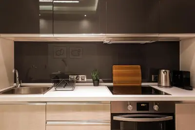 a kitchen with a sink and a stove top oven at Tranquil Studio in Pangrati Athens Center in Athens