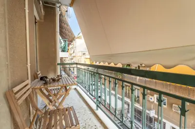 a balcony with a bench and a railing at Rustic Whispers - close to Acropolis in Athens