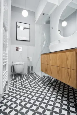 a bathroom with a black and white checkered floor at Kaplanon Residence Kolonaki in Athens