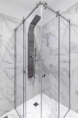 a shower with a glass door in a bathroom at Callisto Elegant Apartment Near Acropolis in Athens
