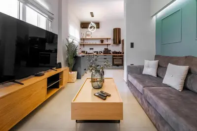 a living room with a couch and a coffee table at Callisto Elegant Apartment Near Acropolis in Athens