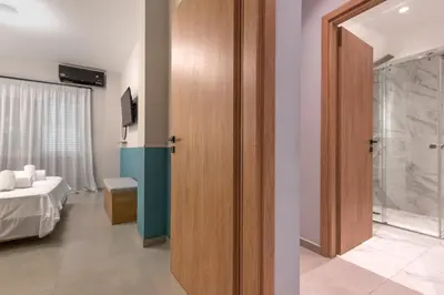 a room with a door leading to a bedroom at Callisto Elegant Apartment Near Acropolis in Athens