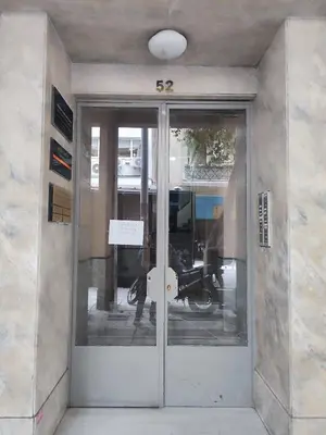 a door to a building with a motorcycle in it at Ideal escape for 2 in Athens