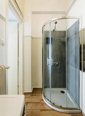 a shower with a glass door in a bathroom at Ideal escape for 2 in Athens