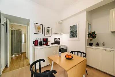 a kitchen and dining room with a table and chairs at Ideal escape for 2 in Athens