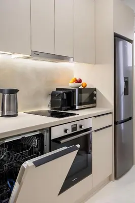 a kitchen with a stove and a microwave at Modern Designer Apartment in Athens Walk to Plaka & Acropolis in Athens