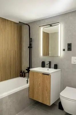 a bathroom with a sink and a tub and a toilet at Modern Designer Apartment in Athens Walk to Plaka & Acropolis in Athens