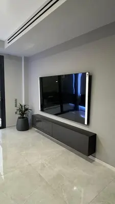 a large flat screen tv on a wall in a room at Oliva luxury apartment in Athens