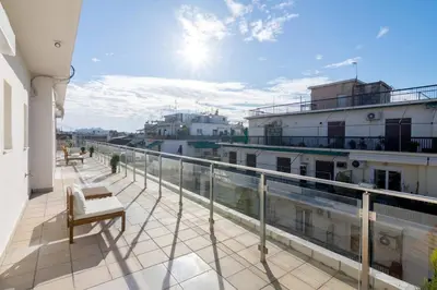 a balcony with a view of a building at Acropolis & Lycabetus View Helios Residence in Athens