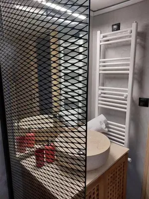 a bathroom with a sink and a mirror at Apartment with children's room in the city of Athens in Athens