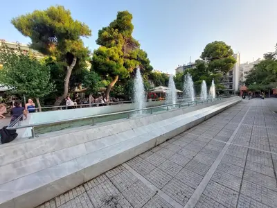 a row of water fountains on a sidewalk at Apartment with children's room in the city of Athens in Athens