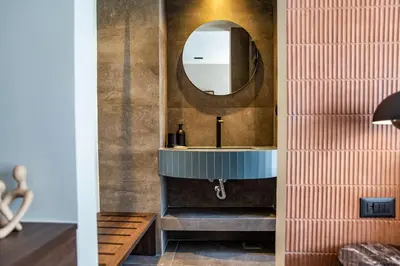 a bathroom with a sink and a mirror at NOOS Acropolis in Athens