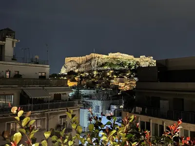 a view of a city with a mountain in the background at NOOS Acropolis in Athens
