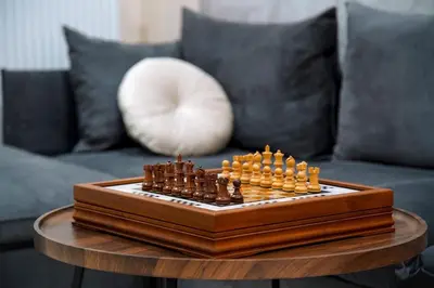 a chess board on a table in front of a couch at Aegean Modern Escape VIPGreece in Piraeus