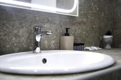a bathroom sink with a faucet on a counter at Aegean Modern Escape VIPGreece in Piraeus