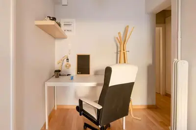 a black and white chair in a room with a desk at Athenian Entertainment & Relaxation Hub in Athens
